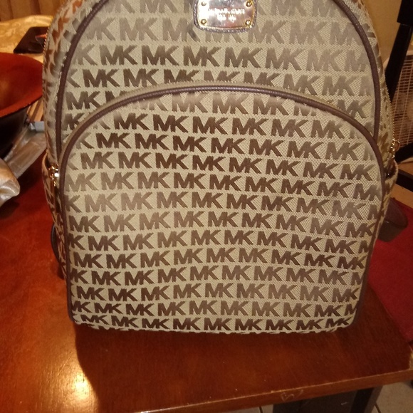Micheal khors book bag and a swiss legend watch main image 4